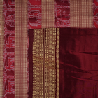 Close-up of the fine silk texture of the white Sambalpuri saree, highlighting its soft sheen and weave.