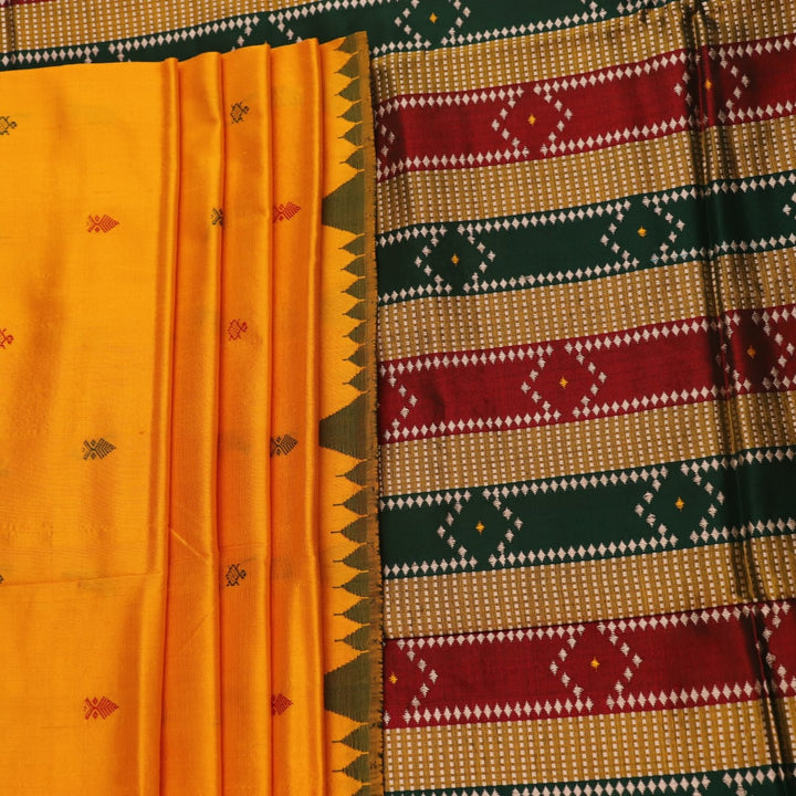 Close-up of yellow & green Sambalpuri Silk Saree fabric texture, showing Butta pattern.