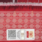 Close-up of the maroon Sambalpuri silk saree fabric, highlighting its luxurious texture and intricate weave.