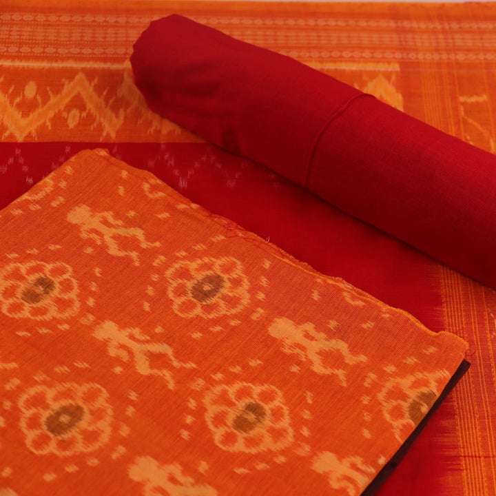 Detail of the rust and red Sambalpuri cotton dress material's blouse piece with motifs.