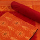 Detail of the rust and red Sambalpuri cotton dress material's blouse piece with motifs.