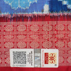 Close-up of the luxurious silk fabric texture and distinctive Sambalpuri ikat weave of the blue Pasapalli saree.