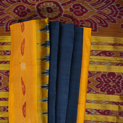 Model styling a blue and yellow Khandua silk saree with traditional butta work and border.