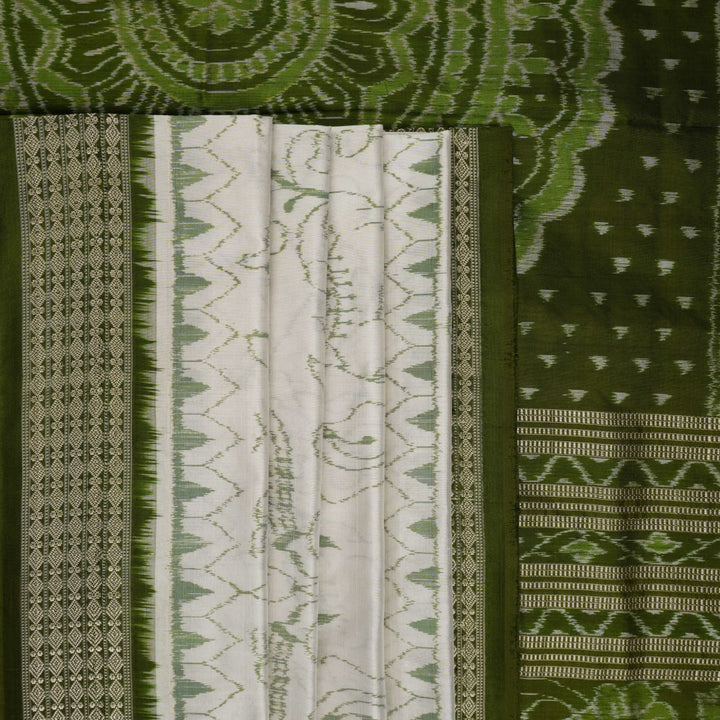 Close-up of the luxurious texture of the white Sambalpuri Silk Saree, revealing the fine weave and motif details.