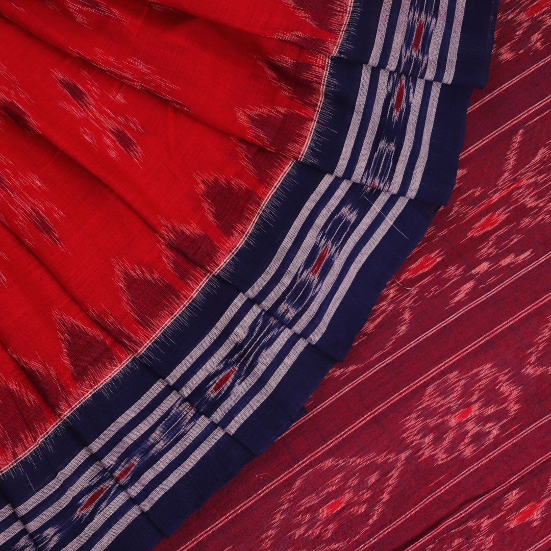 Red and blue Sambalpuri cotton saree draped to show styling and overall look.