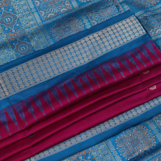 Close-up of Bomkai silk saree's textured weave, featuring magenta, blue, and butta pattern.
