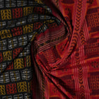 Full layout of the black and red Sambalpuri cotton saree displaying the complete pattern and border design.