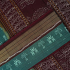Full flat layout of green and maroon Sambalpuri cotton saree showcasing the complete body and pallu motifs.