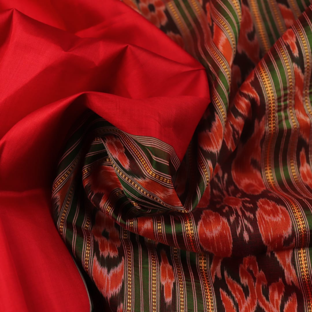 Red and green Khandua silk saree draped, showcasing the overall look and fall.
