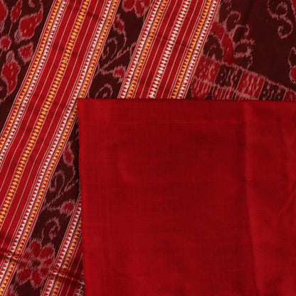 Close-up of plain green Sambalpuri silk saree fabric texture.