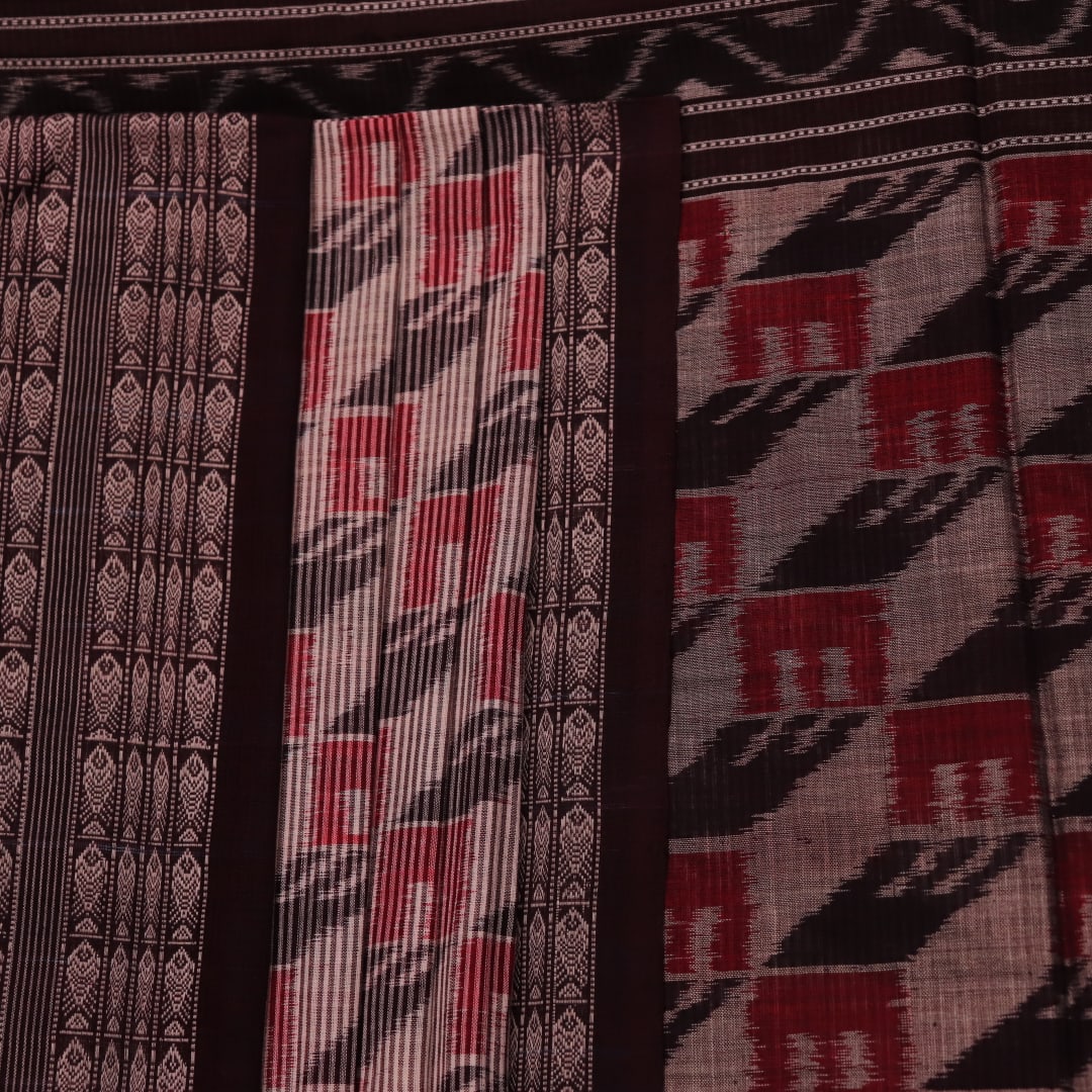 Grey and black cotton Sambalpuri saree with intricate motif pattern, displayed in full view.