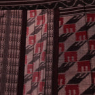 Grey and black cotton Sambalpuri saree with intricate motif pattern, displayed in full view.