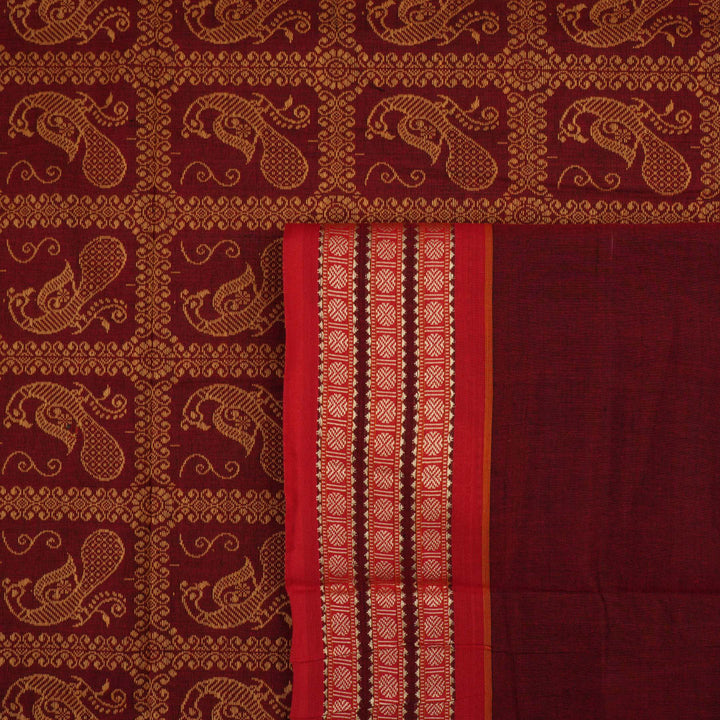 Full view of the maroon Bomkai cotton saree with red borders and small butta motifs laid out flat.