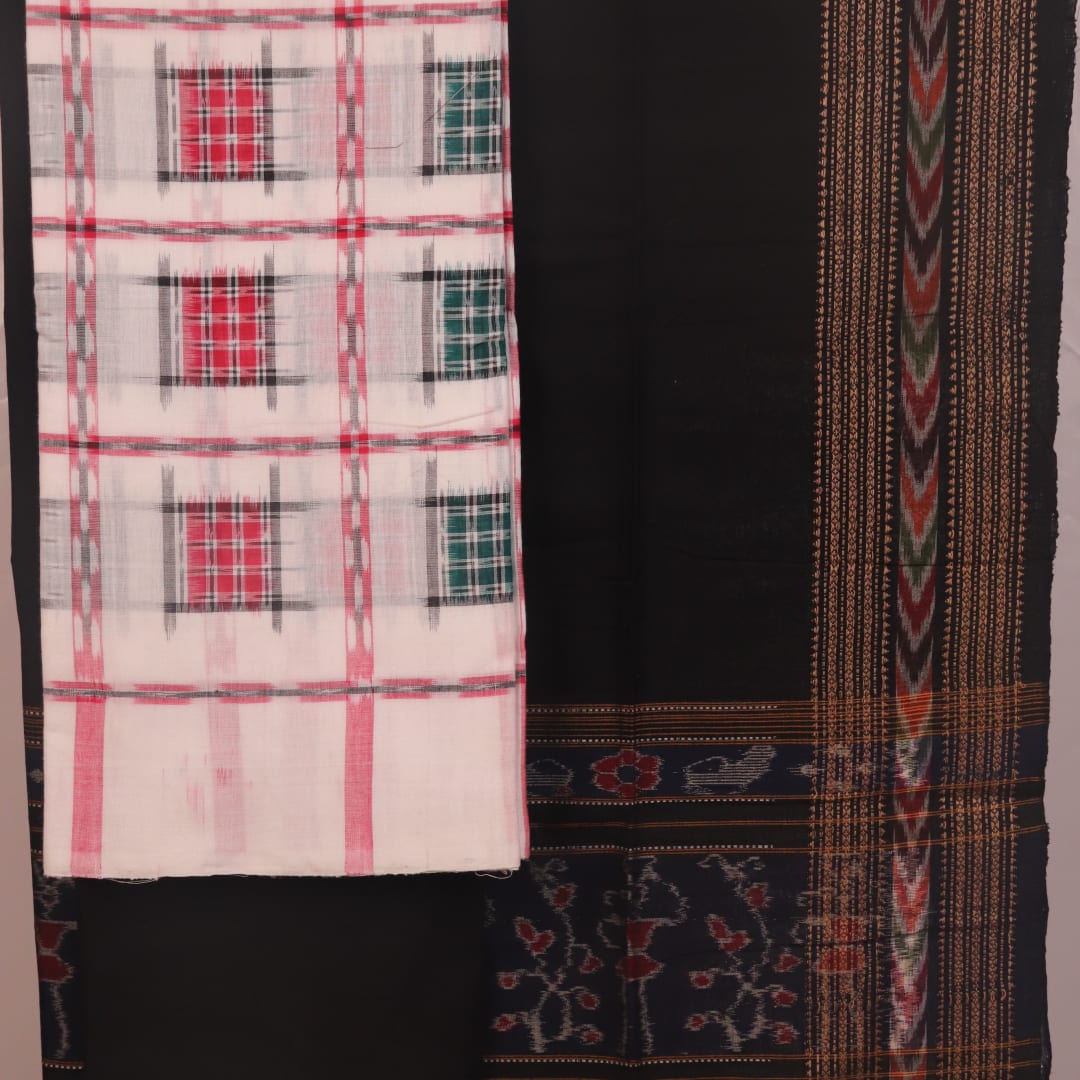 Detail of the motif-patterned blouse piece from a white and black Sambalpuri cotton dress material.