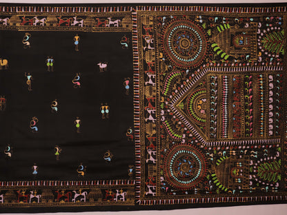 Close-up of the black silk Patachitra saree, showcasing the hand-painted fabric texture.