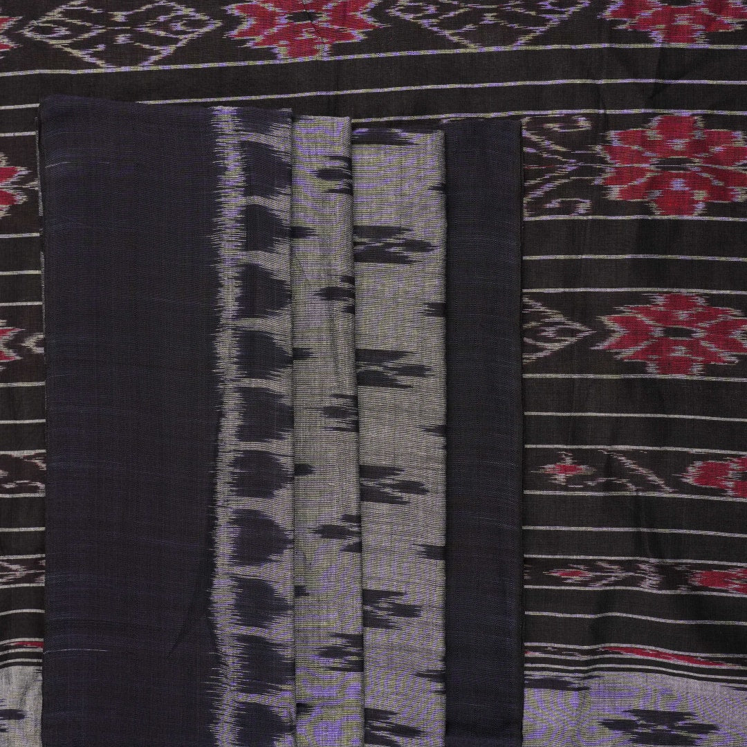 Model styled in a grey and black Sambalpuri cotton saree showing the elegant drape and traditional motifs.