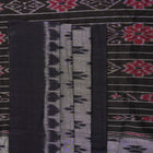 Model styled in a grey and black Sambalpuri cotton saree showing the elegant drape and traditional motifs.