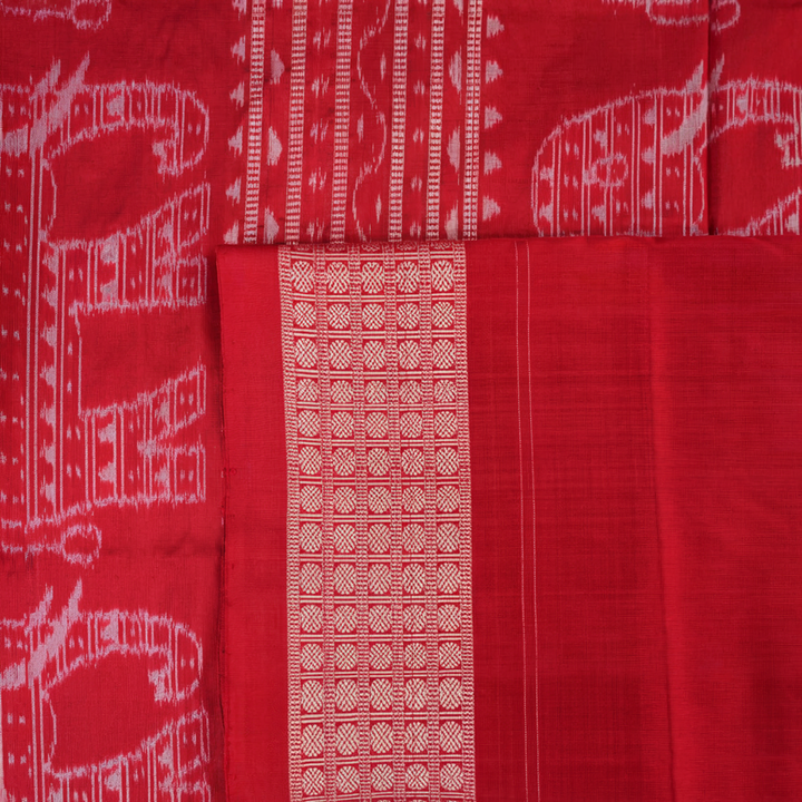 Close-up showing the luxurious texture and fine weave of the black Sambalpuri silk fabric.