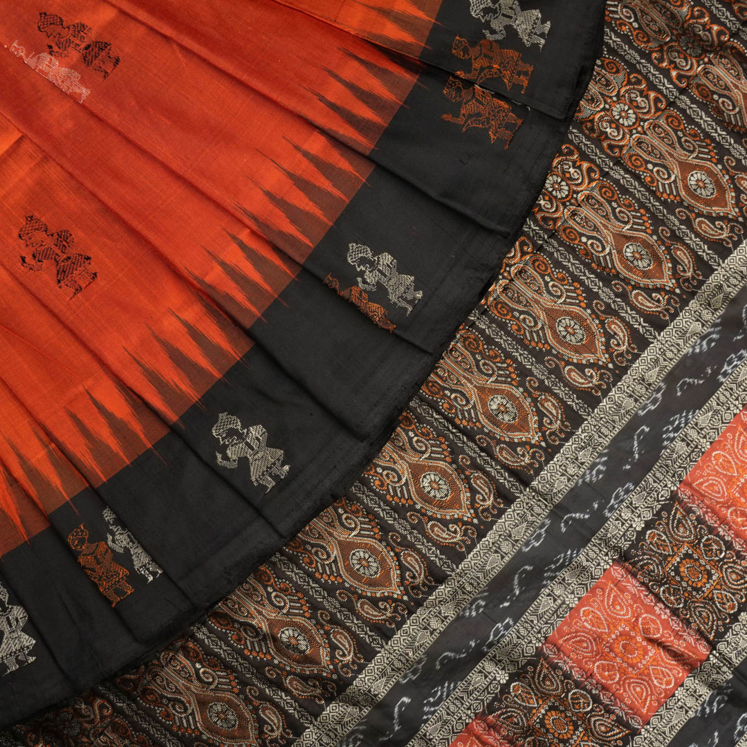 Ultra close-up of Bomkai Silk Saree fabric, revealing intricate handloom texture and butta weave details.