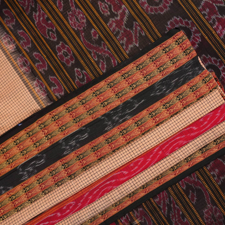 Model elegantly draped in a cream and black Sambalpuri cotton handloom saree with traditional ikat motifs.