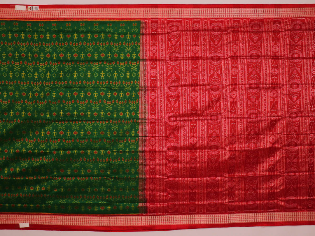 Close-up of green and orange silk Sambalpuri saree fabric with intricate motif patterns