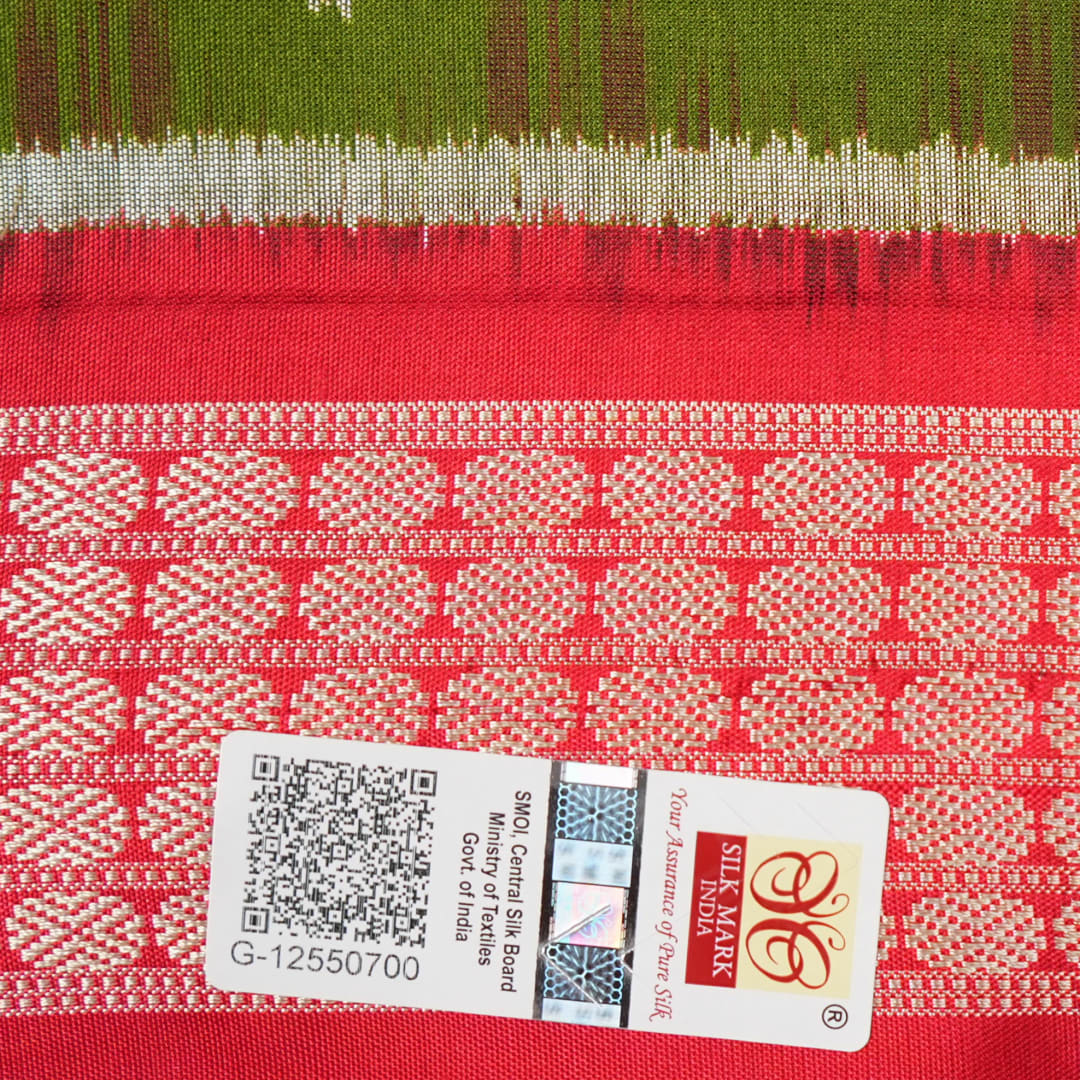 Close-up showing the rich, smooth texture of the green Sambalpuri Silk Saree's weave, highlighting its quality.