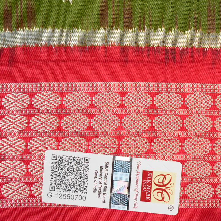 Close-up showing the rich, smooth texture of the green Sambalpuri Silk Saree's weave, highlighting its quality.