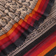 Close-up of off-white Tussar silk fabric, highlighting natural slubs and printed black pattern.