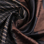 Close-up of the natural slub texture of grey printed Tussar silk saree fabric.