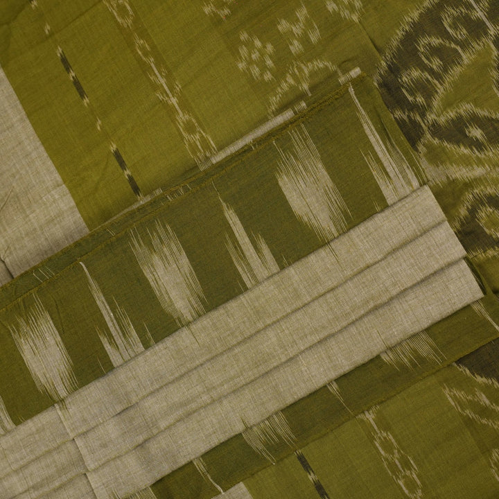 Full styling view of a model draped in a plain green Sambalpuri cotton saree with traditional accents.