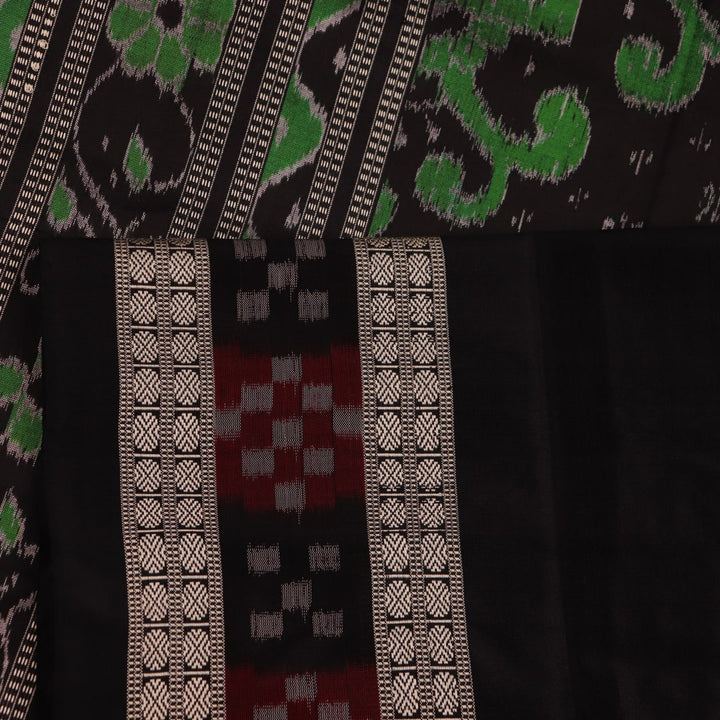 Close-up view of intricate Pasapalli pattern on a shimmering pink and black Sambalpuri silk saree