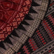 Close-up view of maroon and black silk Sambalpuri saree fabric showcasing intricate motifs