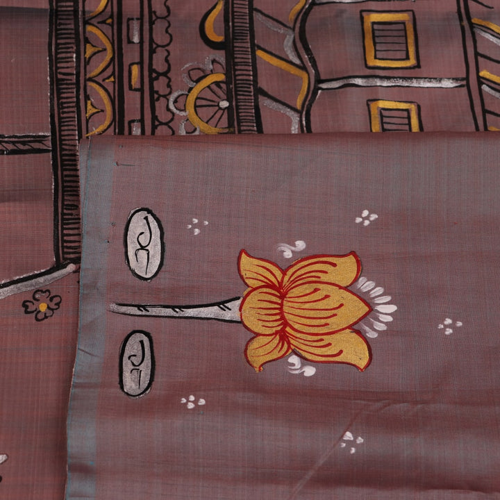 Close-up of multicolored Patachitra silk saree fabric texture showing hand-painted details.