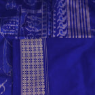 Close-up of green and blue Sambalpuri silk saree fabric showing intricate handloom weave and motif details.