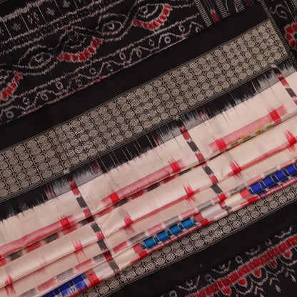 Close-up of white silk handloom saree with black Sambalpuri motifs