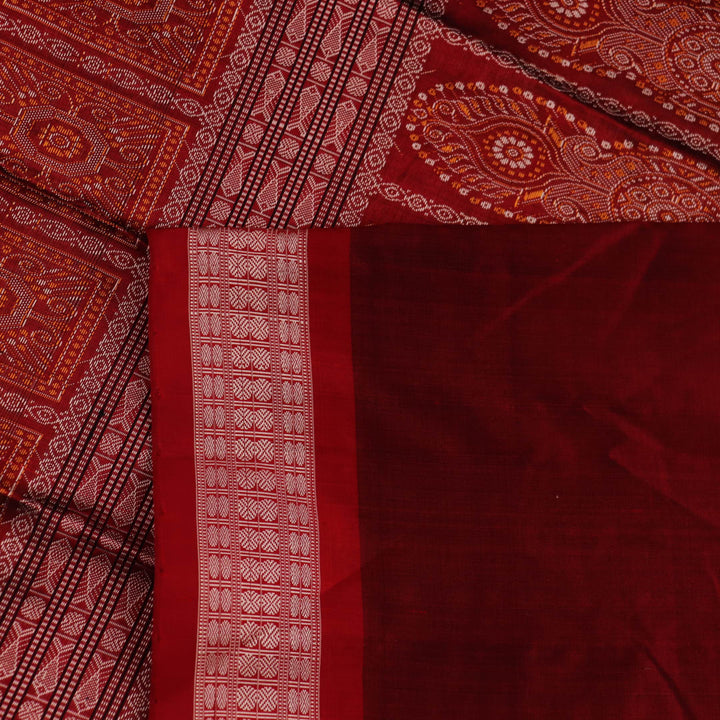 Close-up of black and red silk Sambalpuri saree fabric showcasing intricate motifs