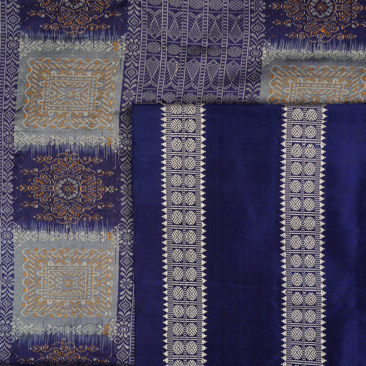 Close-up of luxurious Bomkai Silk Saree fabric texture, highlighting grey and blue handloom weave.