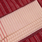 Entire white and maroon striped Sambalpuri cotton saree laid out.
