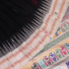 Close-up texture of black and white Bomkai silk saree with butta pattern.