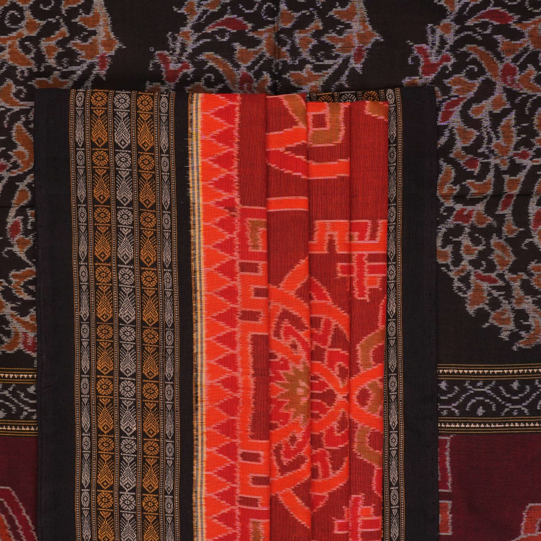 Full flat layout of the orange and black Sambalpuri cotton saree showing the body, border, and pallu