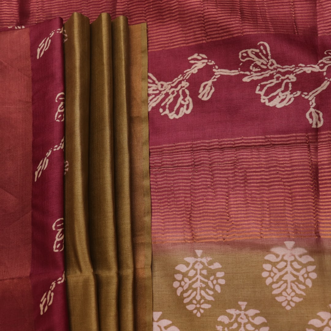 Close-up of the distinctive slub texture of a multi-color printed Tussar Silk saree.