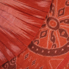 Professional styling view of a rust Sambalpuri cotton saree draped on a model for an elegant ethnic look.