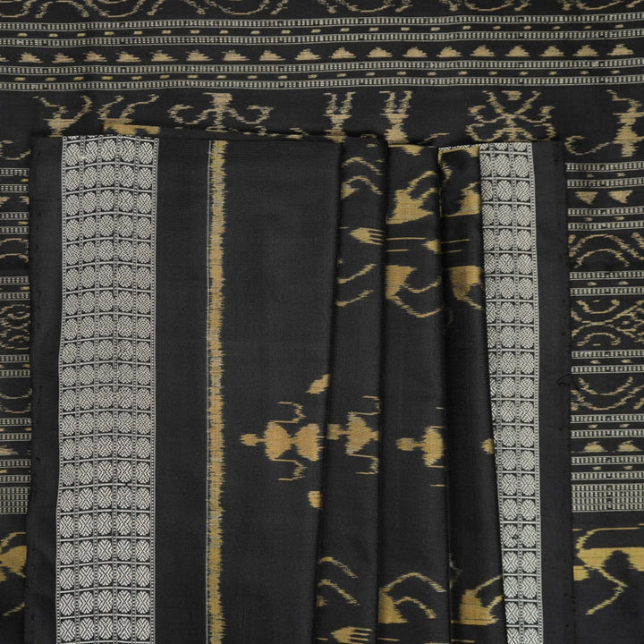 Close-up of the lustrous black Sambalpuri silk fabric, revealing its luxurious texture and fine weave.