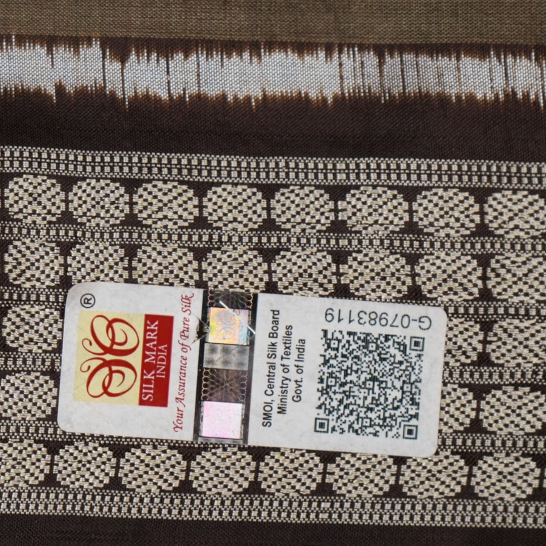 Close-up of the grey and black Sambalpuri Silk Saree fabric, highlighting its rich silk texture and weave.