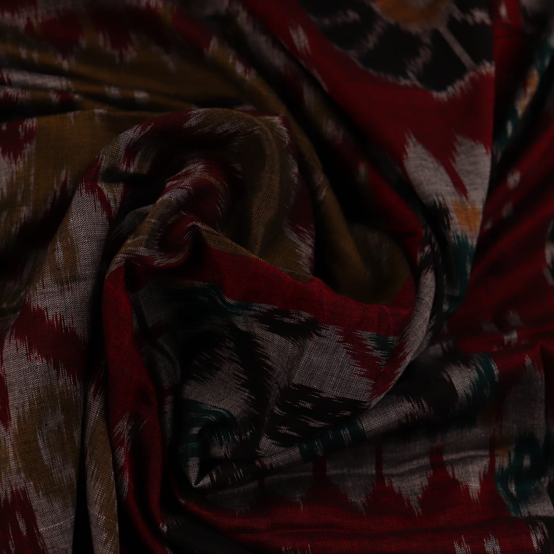 Green and Red Cotton Sambalpuri Saree Draped in a Stylized Manner