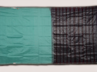 Ultra close-up of the luxurious green Sambalpuri handloom silk weave, highlighting its smooth texture.