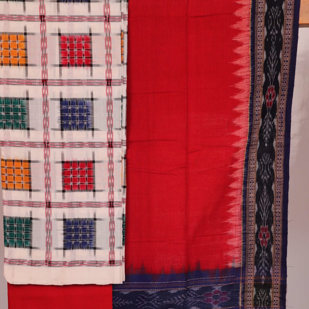 Close-up of white cotton Sambalpuri dress material with red motifs