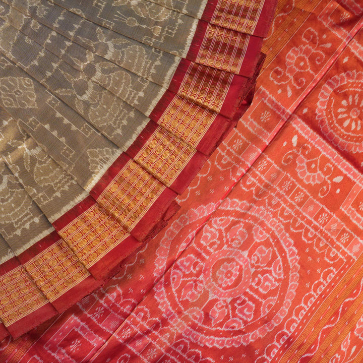 Ultra close-up of Sambalpuri silk saree fabric, showing luxurious texture and tissue motif weave.
