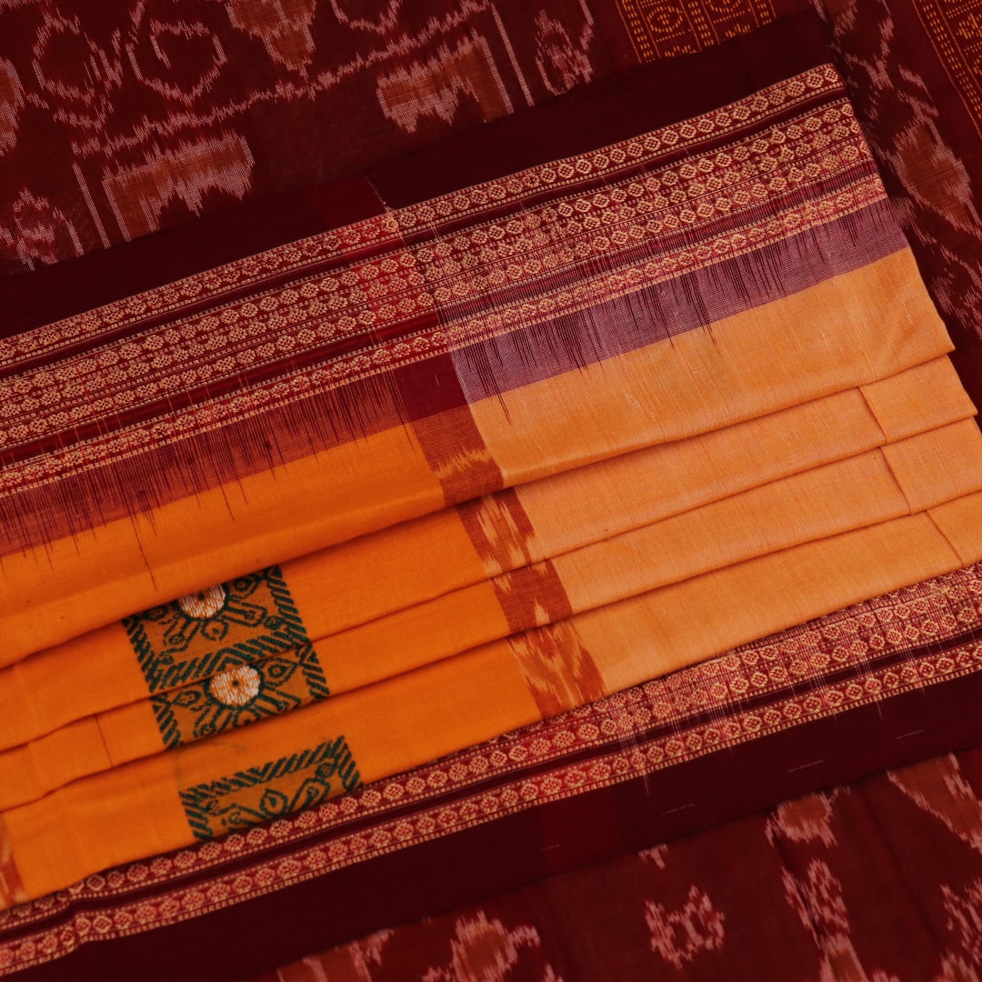 Full view of a yellow cotton Bomkai saree with maroon border and intricate butta pattern