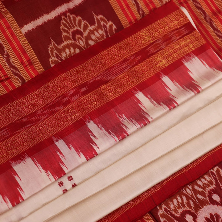 Khandua silk saree styled; white with red butta design, showcasing drape and overall look.